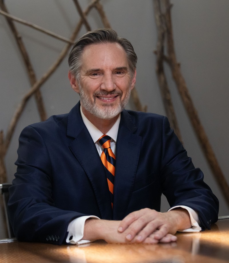 Mike Shipman, Founder of Shipman Law, seated at a conference table